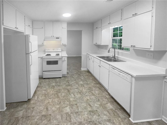 kitchen featuring white appliances, a sink, and white cabinets