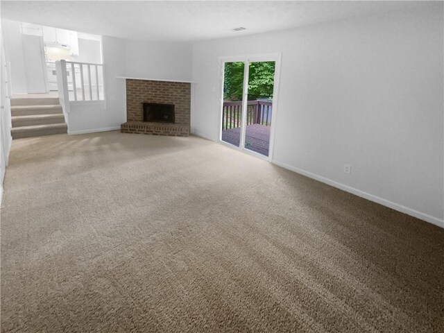 unfurnished living room with baseboards, light carpet, and a fireplace