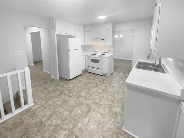 kitchen with white appliances, a sink, light countertops, and light flooring