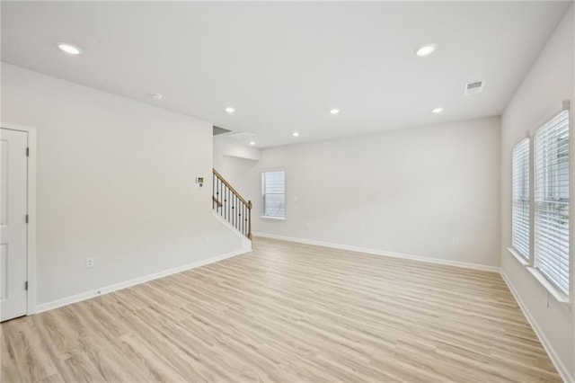 2770 Aralynn Way, College Park, GA 30337 - unfurnished room with visible vents, stairway, light wood-style flooring, and baseboards