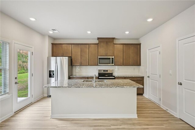 2770 Aralynn Way, College Park, GA 30337 - kitchen featuring appliances with stainless steel finishes, tasteful backsplash, plenty of natural light, and a sink