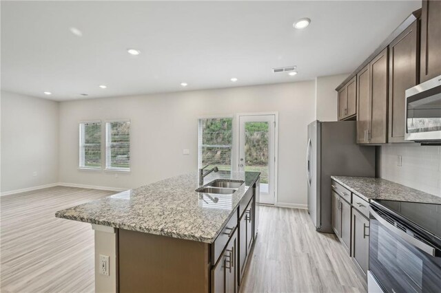 2770 Aralynn Way, College Park, GA 30337 - kitchen with light wood-type flooring, stainless steel appliances, a healthy amount of sunlight, and a sink