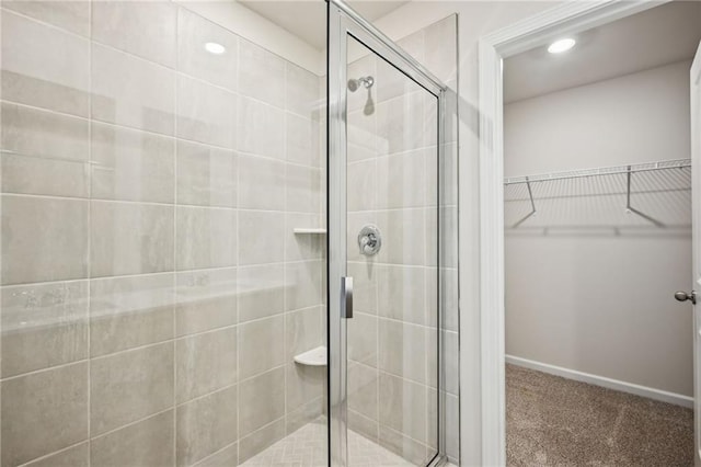 2770 Aralynn Way, College Park, GA 30337 - bathroom featuring a shower stall, recessed lighting, baseboards, and a walk in closet