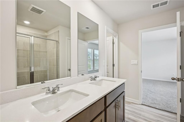 2770 Aralynn Way, College Park, GA 30337 - bathroom with wood finished floors, visible vents, and a sink
