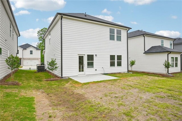 2770 Aralynn Way, College Park, GA 30337 - back of house with a patio, central air condition unit, and a yard