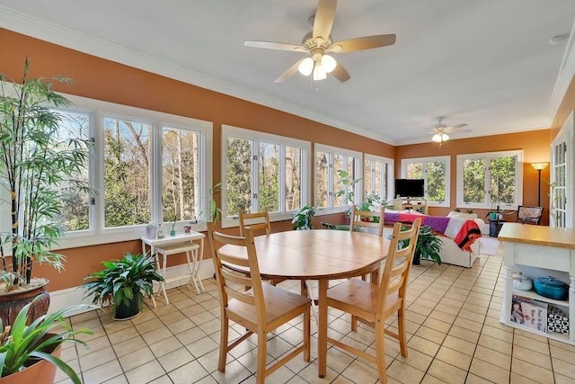 sunroom featuring ceiling fan