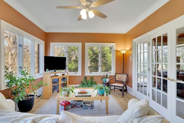 sunroom featuring french doors and ceiling fan