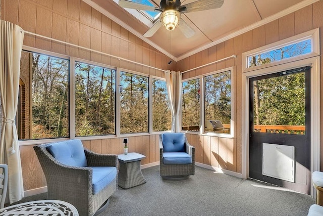 sunroom / solarium featuring ceiling fan and vaulted ceiling