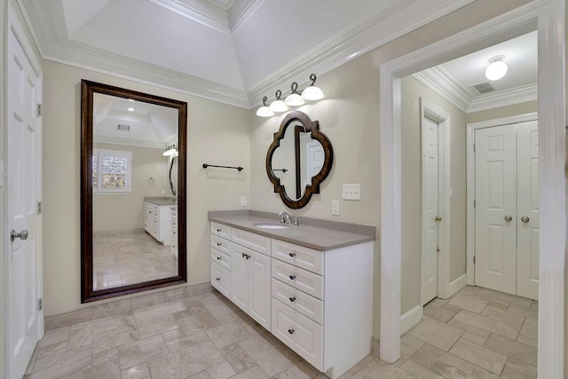 bathroom featuring vanity, lofted ceiling, and crown molding