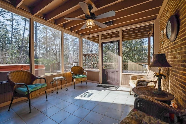 sunroom featuring ceiling fan