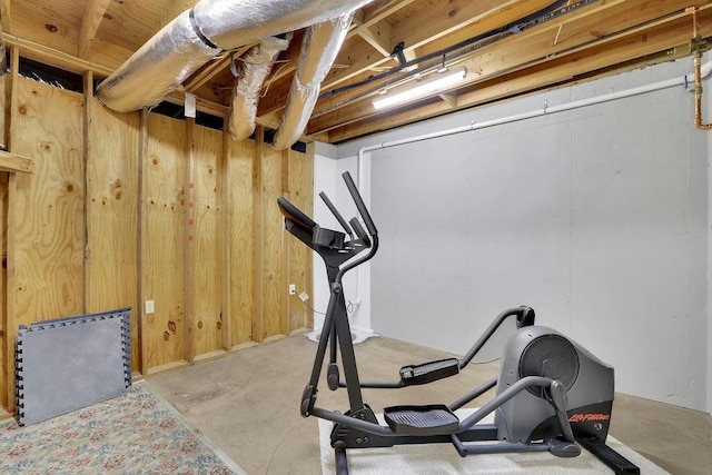 workout area with wood walls