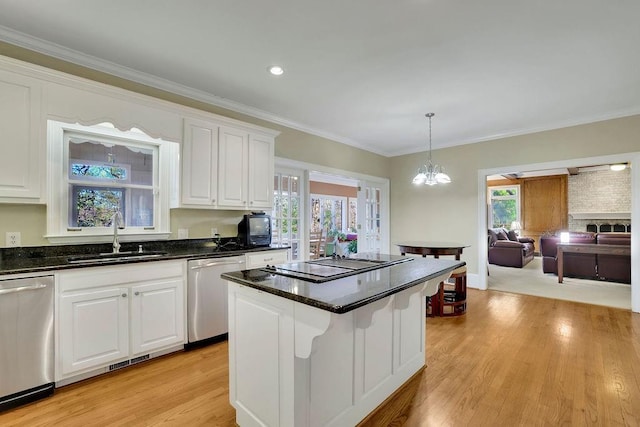 kitchen with white cabinets, dishwasher, black electric stovetop, and sink