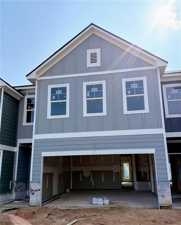 214 Seward St Unit # 94, Conyers, GA 30094 - view of front of property featuring board and batten siding and a garage