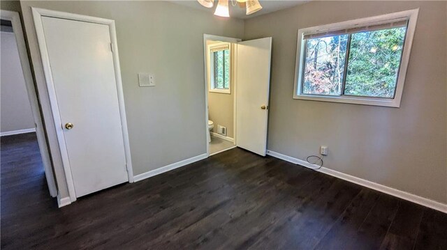 unfurnished bedroom with dark hardwood / wood-style floors and ceiling fan