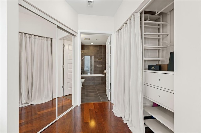 hallway featuring dark wood-type flooring