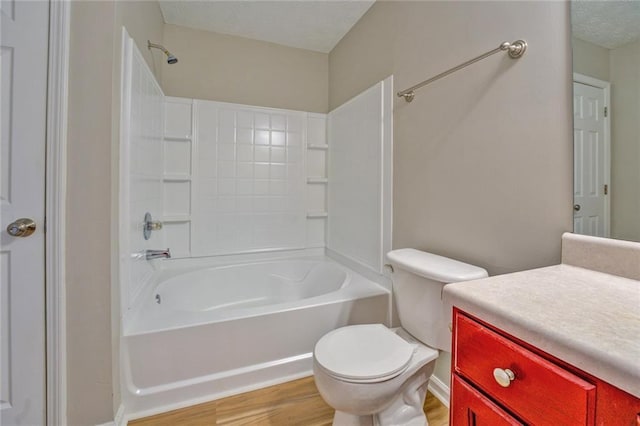 full bathroom with shower / bathing tub combination, vanity, toilet, and hardwood / wood-style floors