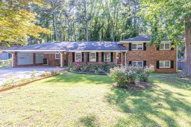2648 Oswood Dr, Tucker, GA 30084 - view of front of home with driveway, a front lawn, an attached carport, and brick siding
