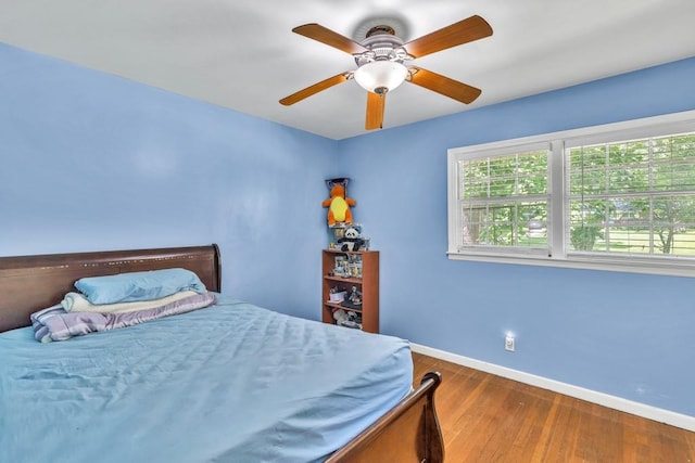 2648 Oswood Dr, Tucker, GA 30084 - bedroom featuring baseboards, wood finished floors, and ceiling fan