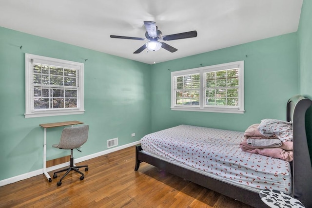 2648 Oswood Dr, Tucker, GA 30084 - bedroom featuring wood finished floors, baseboards, and ceiling fan