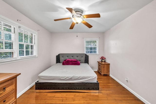2648 Oswood Dr, Tucker, GA 30084 - bedroom with light wood-style floors, baseboards, and ceiling fan