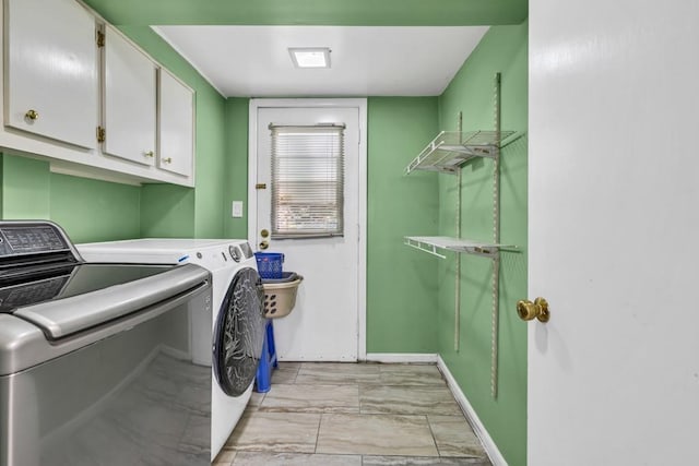 2648 Oswood Dr, Tucker, GA 30084 - washroom with cabinet space, separate washer and dryer, and baseboards