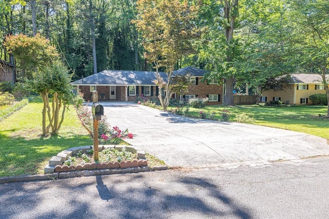 2648 Oswood Dr, Tucker, GA 30084 - view of front of property with a front lawn, driveway, and a carport