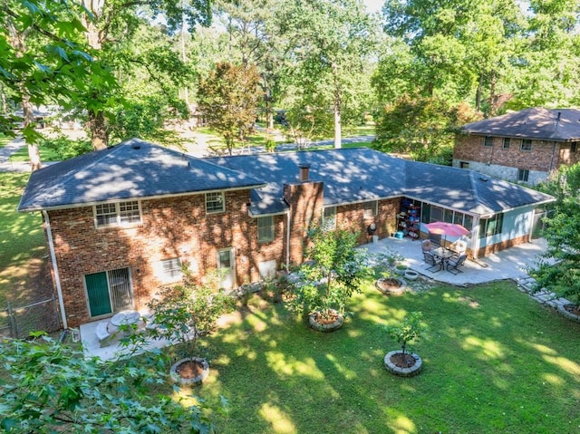 2648 Oswood Dr, Tucker, GA 30084 - view of front of home with a patio area, brick siding, and roof with shingles