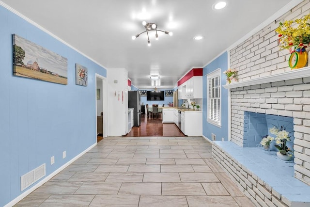 2648 Oswood Dr, Tucker, GA 30084 - kitchen with ornamental molding, white cabinets, appliances with stainless steel finishes, light countertops, and recessed lighting