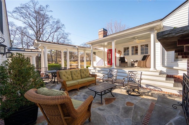 view of patio featuring ceiling fan and an outdoor living space