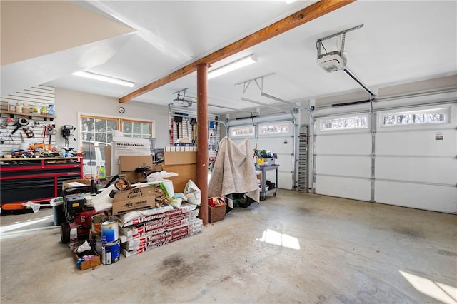 garage featuring a workshop area and a garage door opener