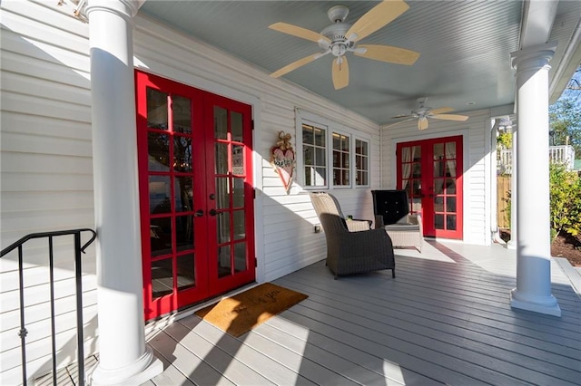 wooden terrace with ceiling fan and french doors