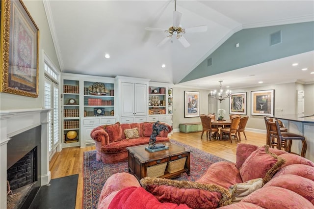 living room with light hardwood / wood-style floors, vaulted ceiling, crown molding, and ceiling fan with notable chandelier