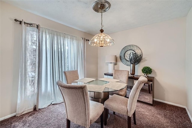 carpeted dining area featuring an inviting chandelier