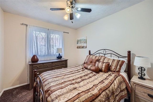 carpeted bedroom with ceiling fan and a textured ceiling