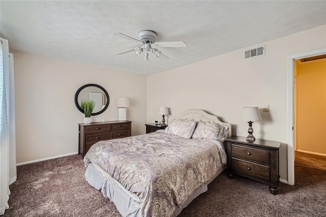 carpeted bedroom featuring a textured ceiling and ceiling fan