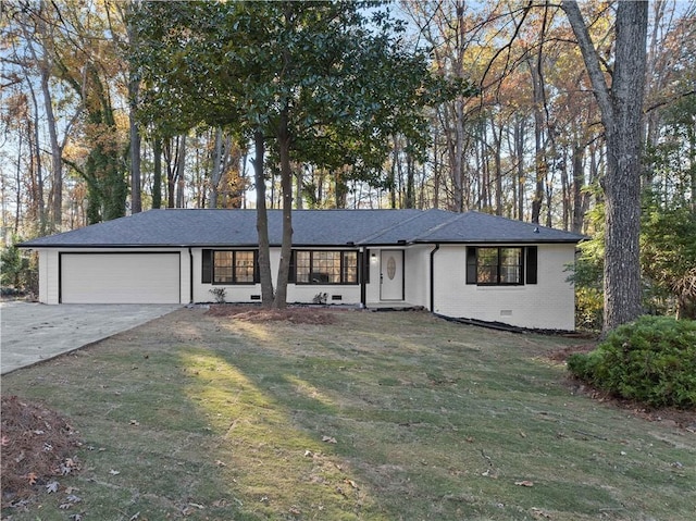 single story home with a front yard and a garage