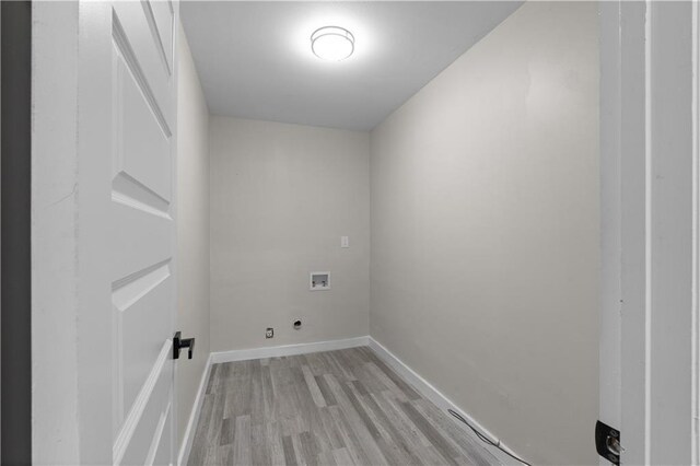 washroom with washer hookup, light wood-type flooring, and electric dryer hookup