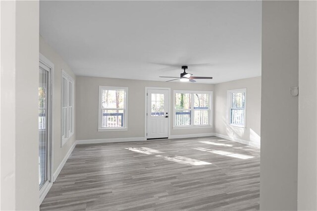 interior space featuring hardwood / wood-style floors and ceiling fan