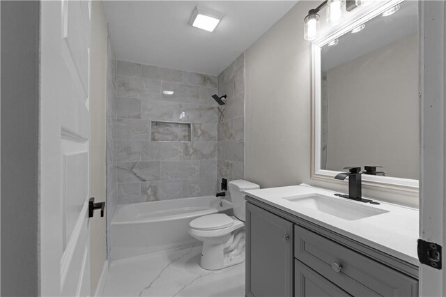 full bathroom featuring vanity, toilet, and tiled shower / bath