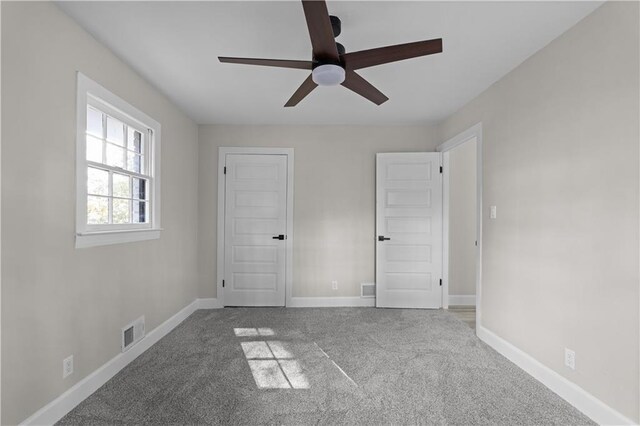 unfurnished bedroom featuring carpet flooring and ceiling fan