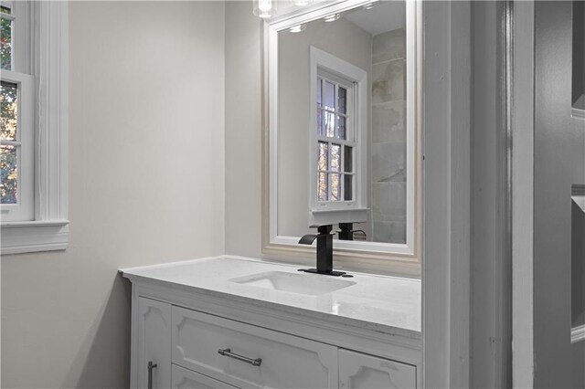 bathroom featuring plenty of natural light and vanity