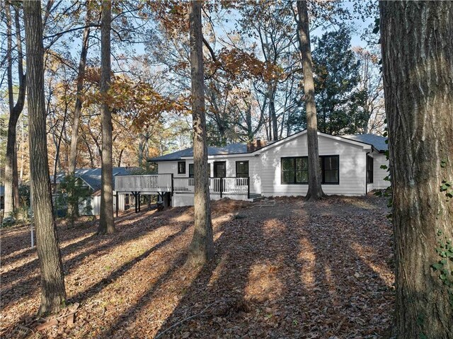 ranch-style home featuring a wooden deck