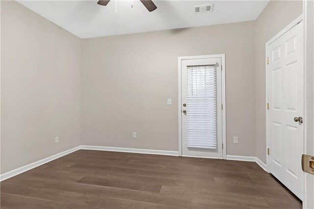 entryway with dark hardwood / wood-style flooring and ceiling fan