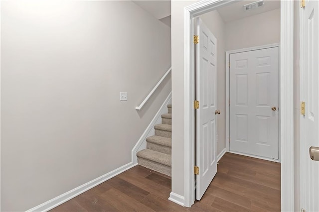 stairs with hardwood / wood-style flooring