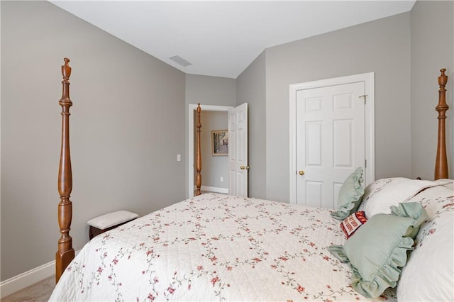 carpeted bedroom with visible vents and baseboards