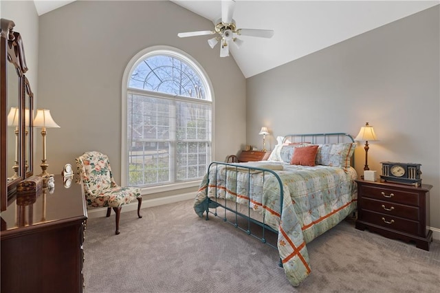 bedroom featuring lofted ceiling, baseboards, carpet floors, and ceiling fan