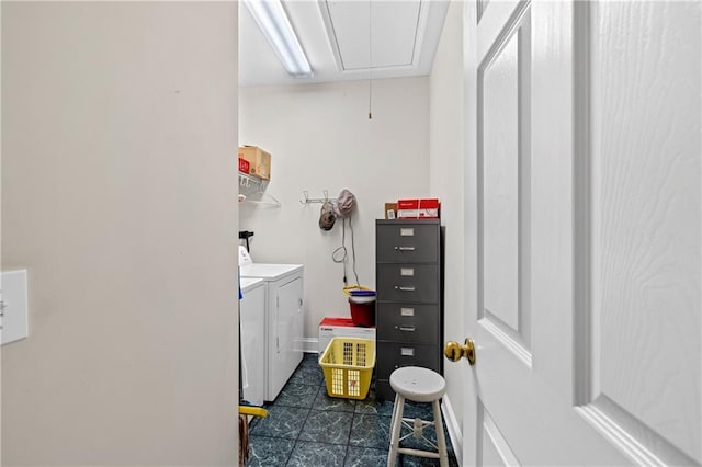 clothes washing area with washer and dryer, laundry area, and attic access