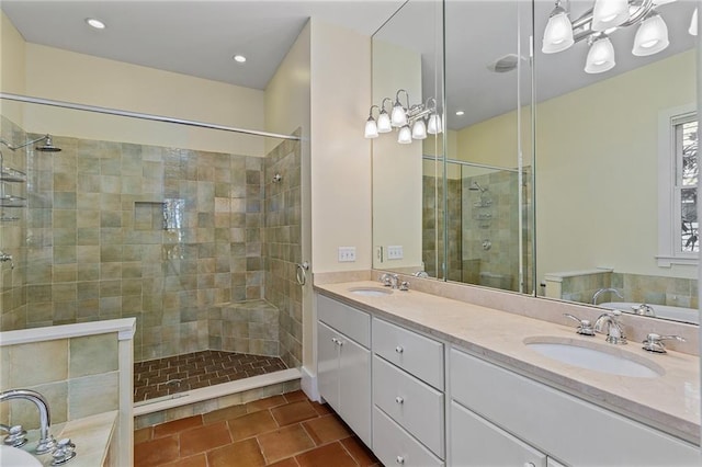 bathroom with tile patterned floors, vanity, and shower with separate bathtub