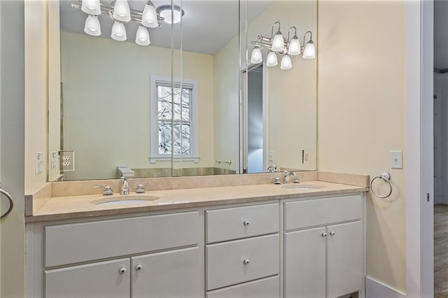 bathroom featuring vanity and hardwood / wood-style flooring