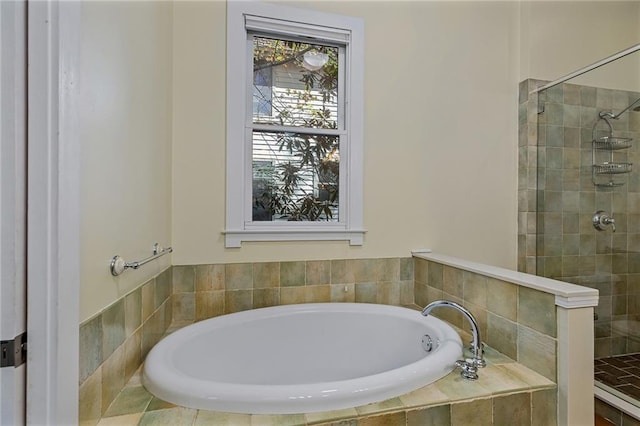 bathroom with shower with separate bathtub